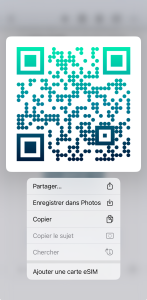 Context menu that appears after a long press on an eSIM QR code on an iPhone to automatically add it
